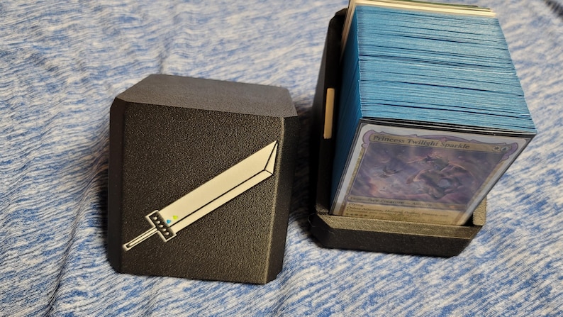 Cloud deck box opened beside a stack of trading cards