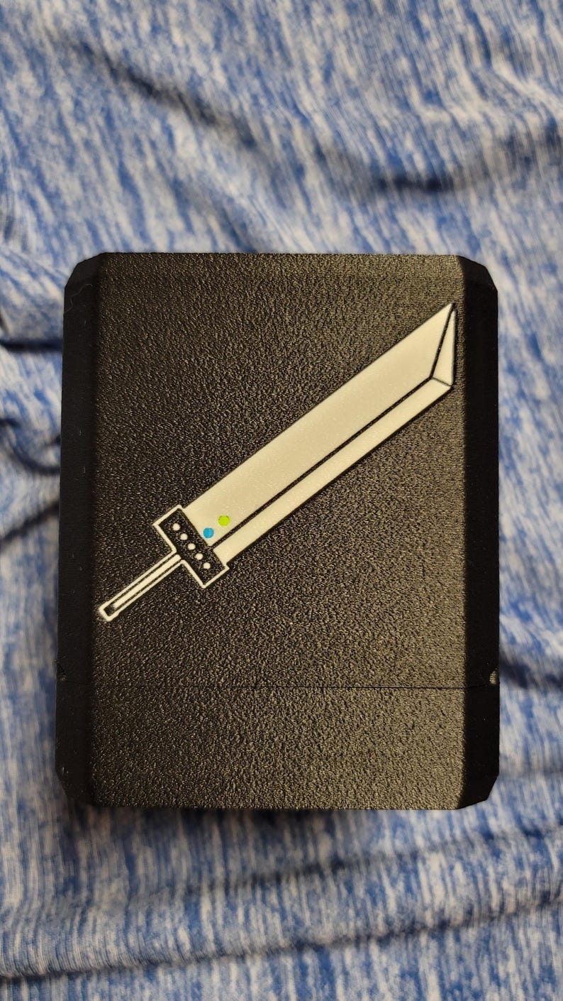 Black Cloud deck box with a white Buster Sword design