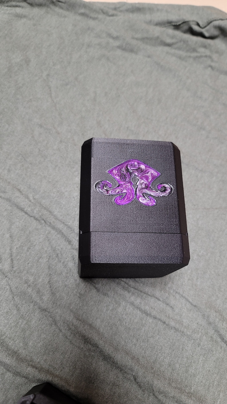 Black Eldrazi deck box with purple swirling resin artwork