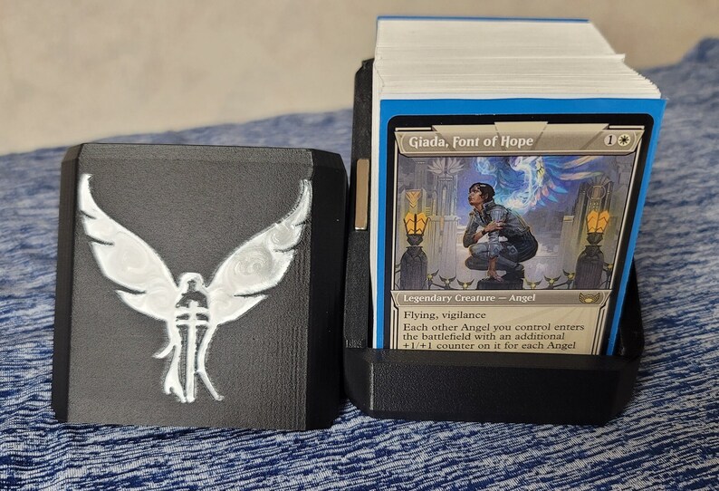 Open Angel deck box showing the card compartment and a Commander card