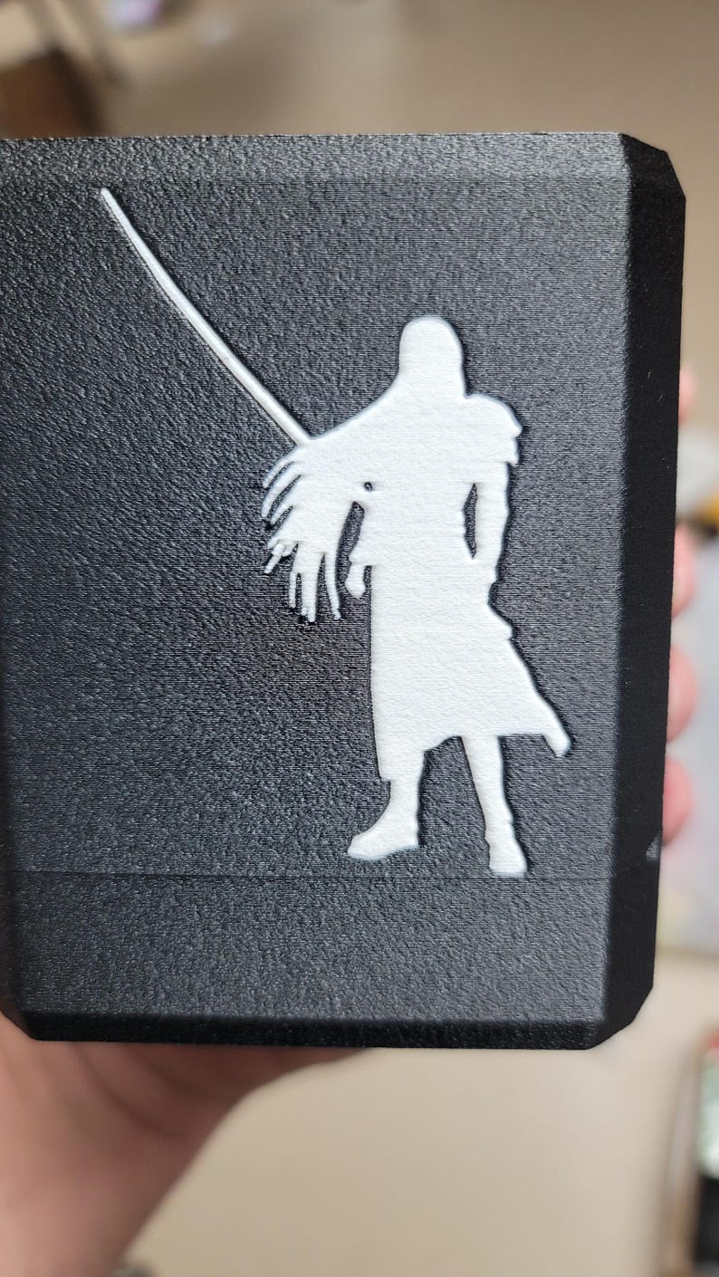 Sephiroth silhouette detail on the textured box lid